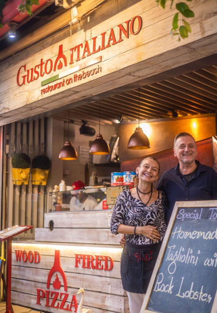 Roberta and Marco at the entrance of Gusto Italiano, Fishermans Village
