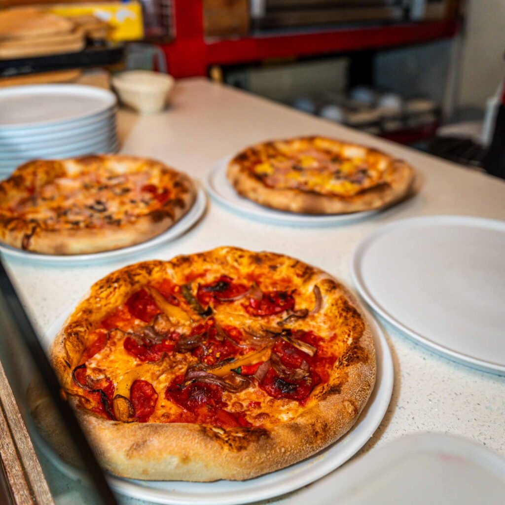 displaying various types of pizzas