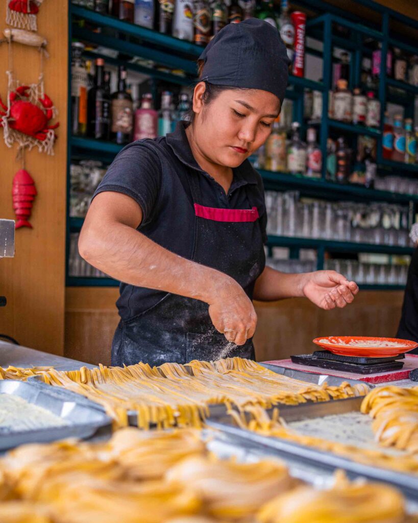 Staff making homemade pasta